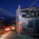 Fire fighters are seen next to a house damaged by an earthquake, measuring magnitude 4.8, at the area north of Catania on the slopes of Mount Etna in Sicily, Italy, December 26, 2018. REUTERS/Antonio Parrinello - RC1F9DC0BF00